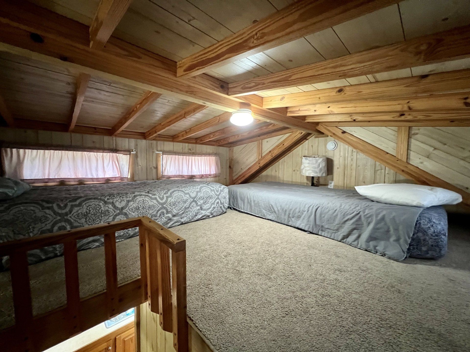 two twin beds in loft of humpy fly cabin at copper johns