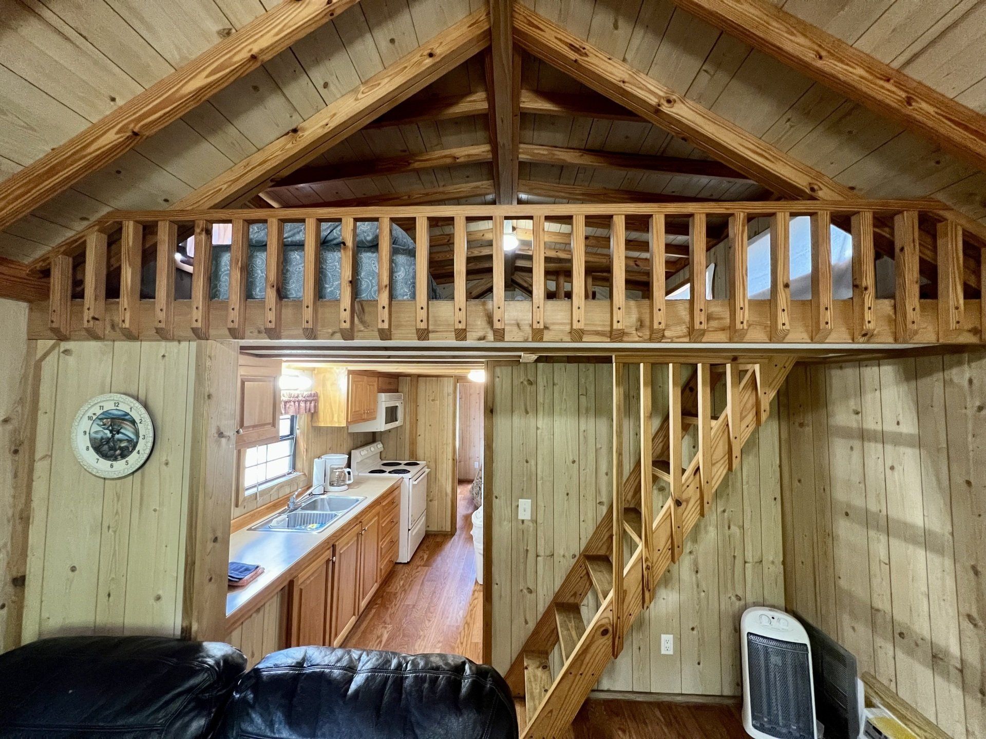 wooden cabin with stairs leading up to the second floor in the humpy fly cabin at copper johns