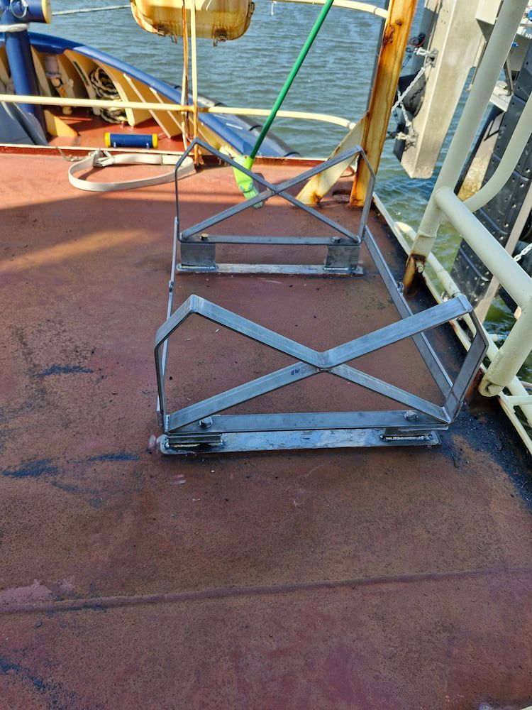 Metal Safety Cage on a Ship Deck, Likely for Securing Equipment — Cairns Metal Works in Portsmith, QLD