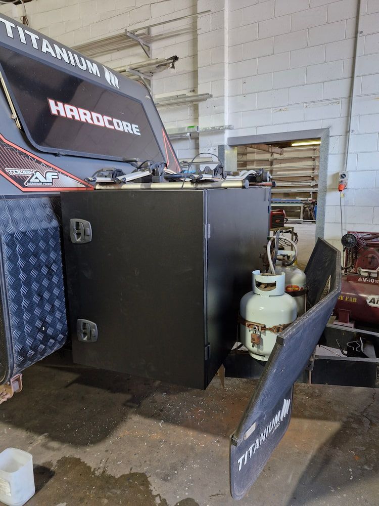 Black Metal Storage Box on a Trailer With Propane Tank — Cairns Metal Works in Portsmith, QLD