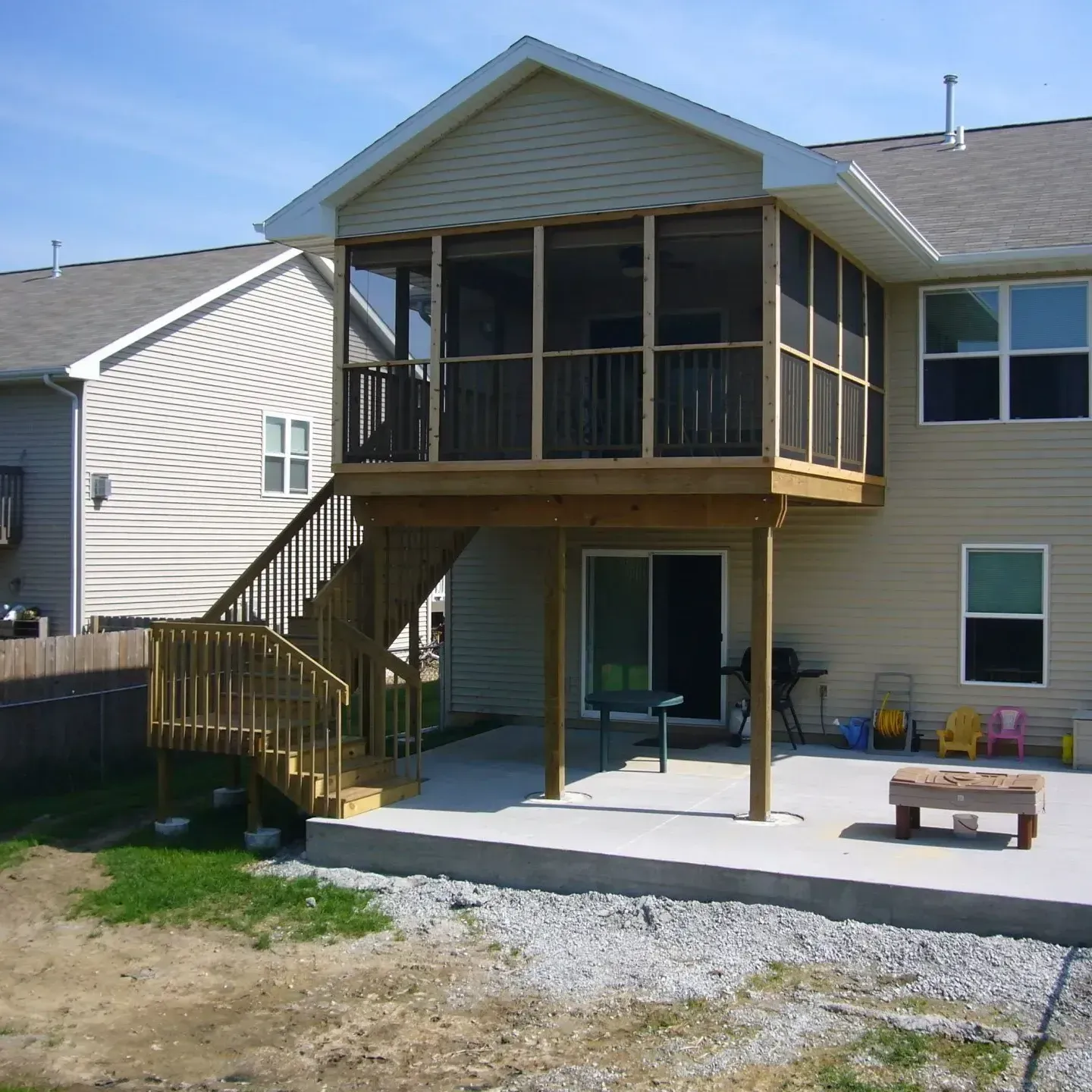 House with Wooden Deck and Stairs — Iowa City, IA — Olson Remodeling & Construction House with Wooden Deck and Stairs — Iowa City, IA — Olson Remodeling & Construction