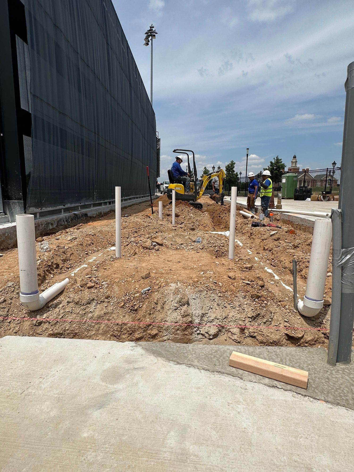 A group of construction workers are working on a construction site.