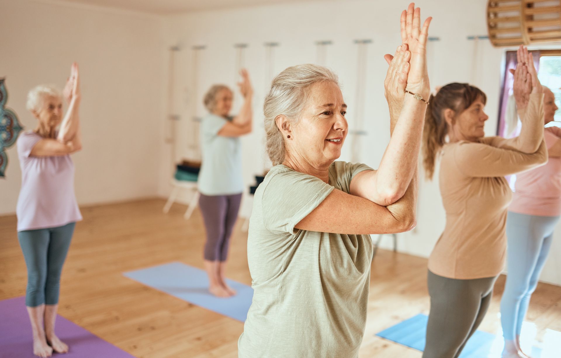 Yoga classes are just one of the many benefits of healthy aging senior communities.