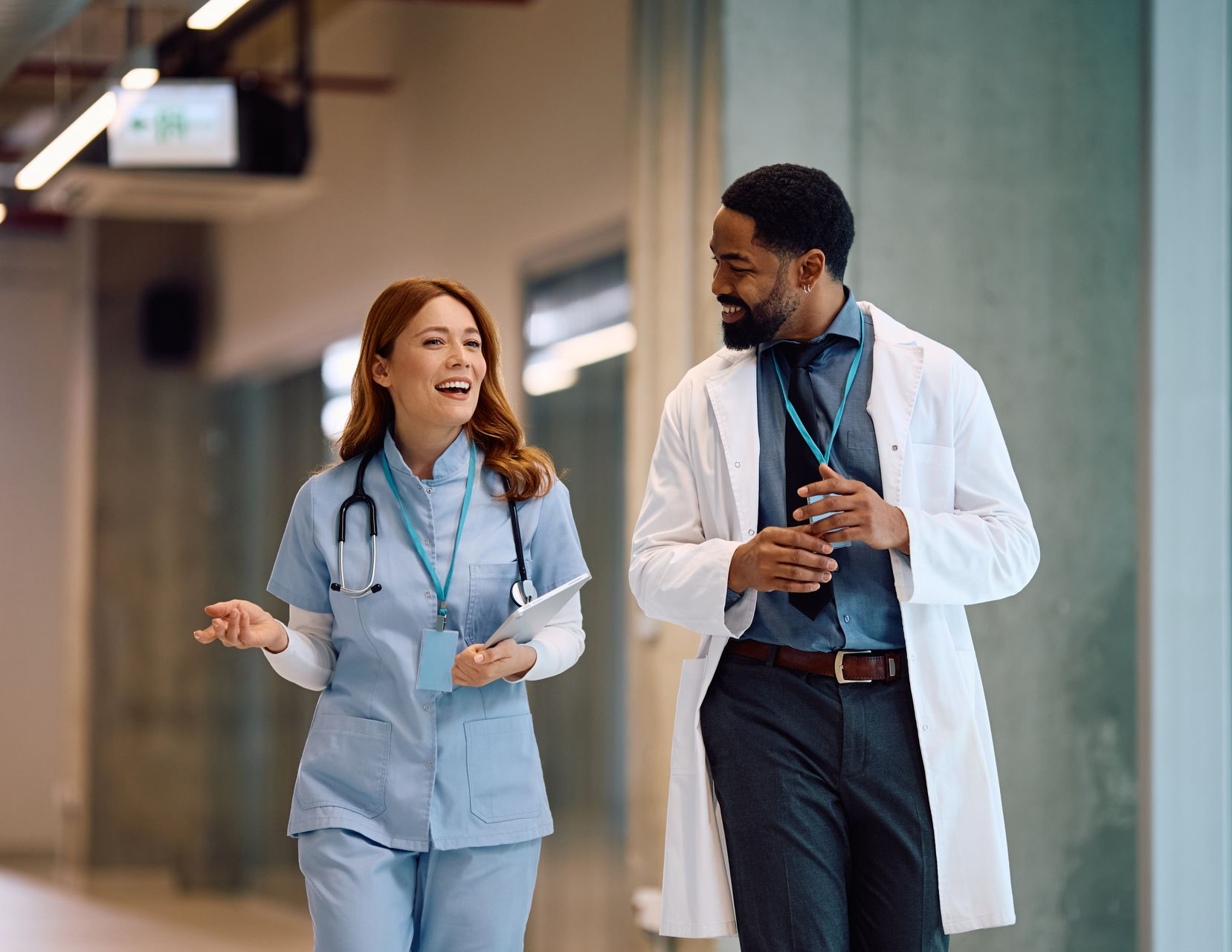nurse and doctor talking to each other