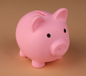 Pink piggy bank on a tan background