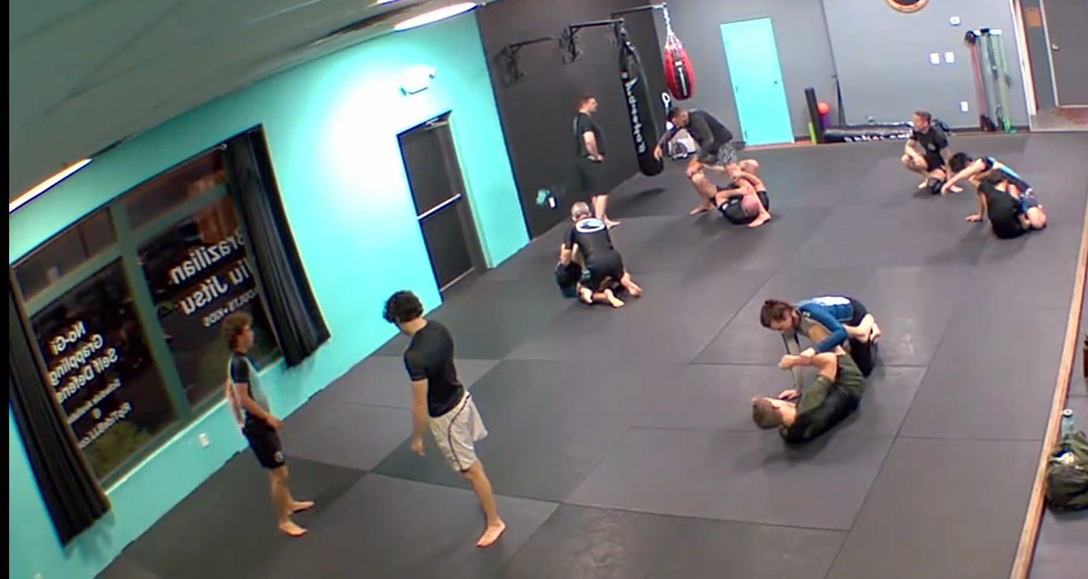 Kids practicing partner drills at Rip Tide Brazilian Jiu Jitsu in Lewes, DE, building teamwork.