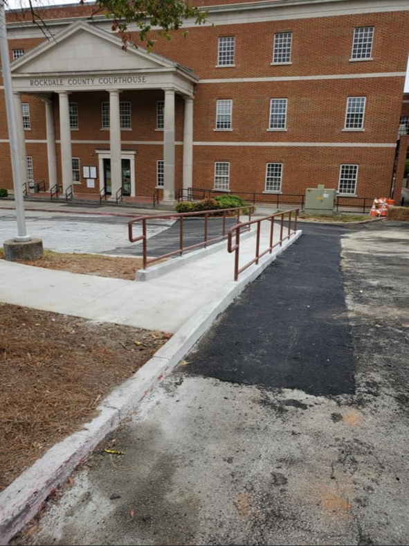 A brick building with a ramp in front of it