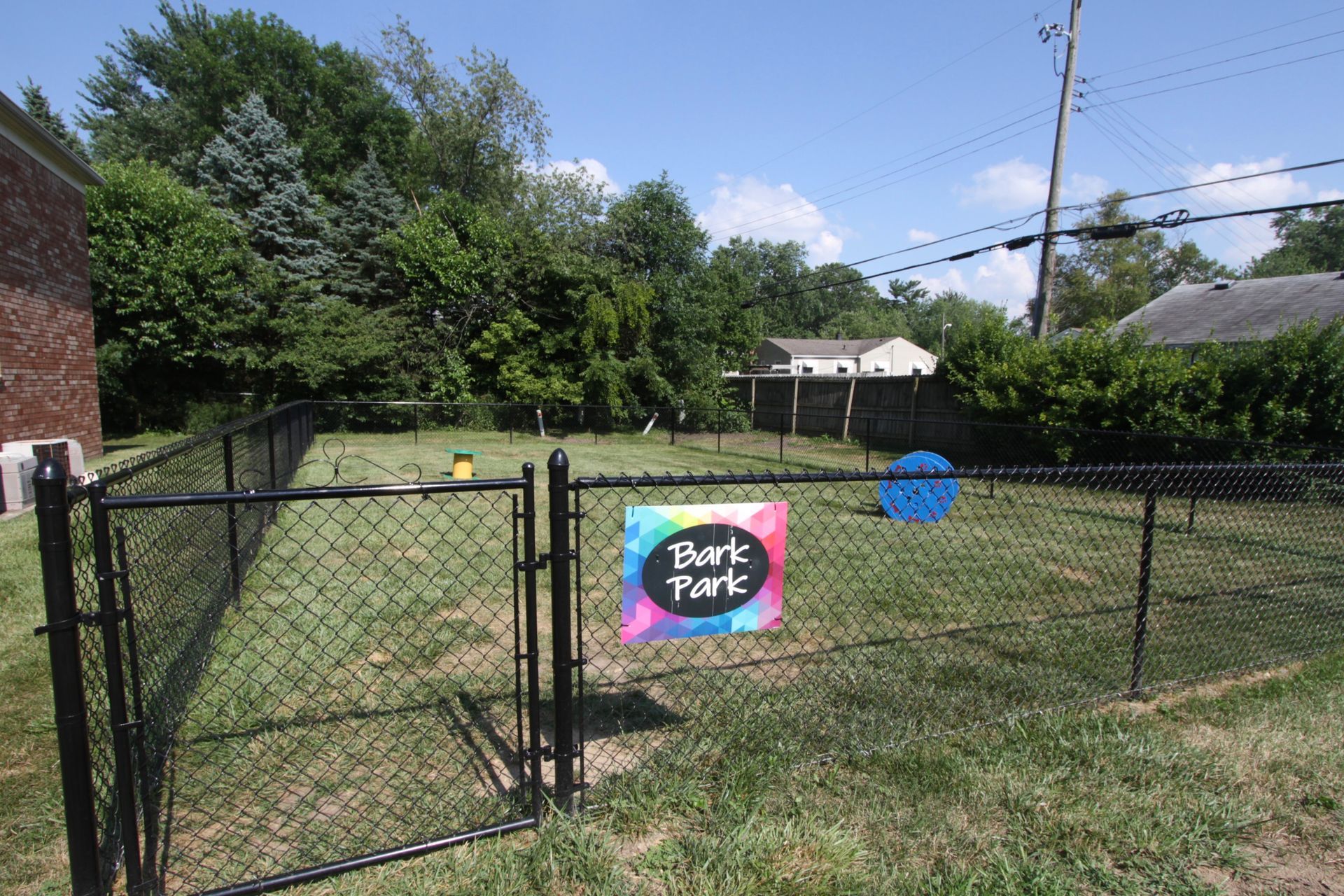 A dog park with a sign that says bark park