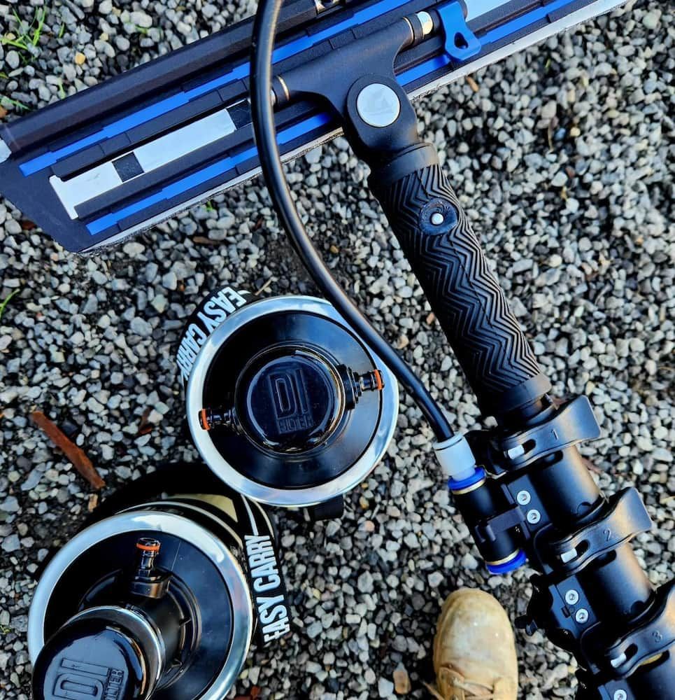 Black and Blue Device With Two Cylinders on Gravel — Rapid Rinse Solutions in Shepparton, VIC