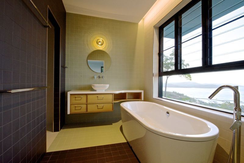 Bathroom with a Beautiful Beach View — Greg Matthews Building in Woodwark, QLD