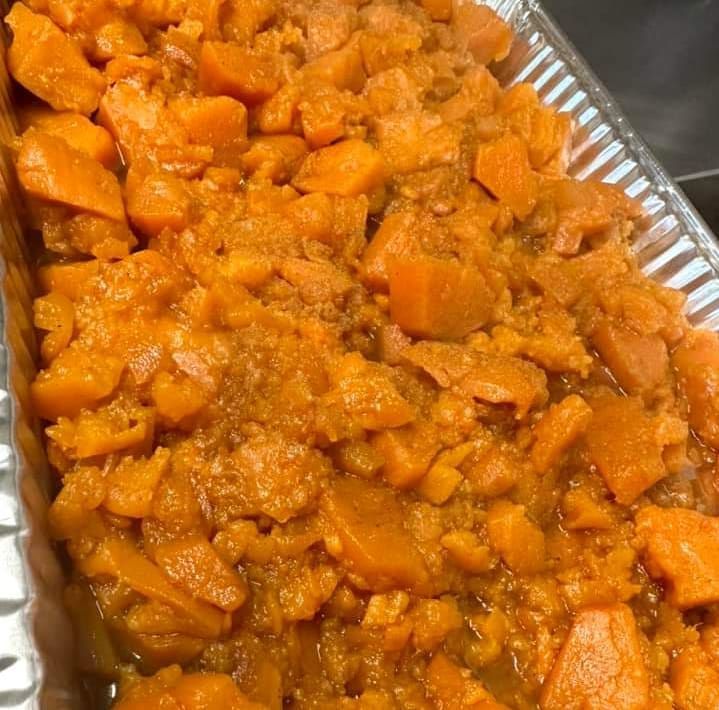 A close up of a casserole dish filled with chopped carrots.