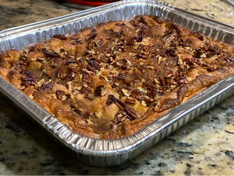 A pan of pecan pie is sitting on a counter.