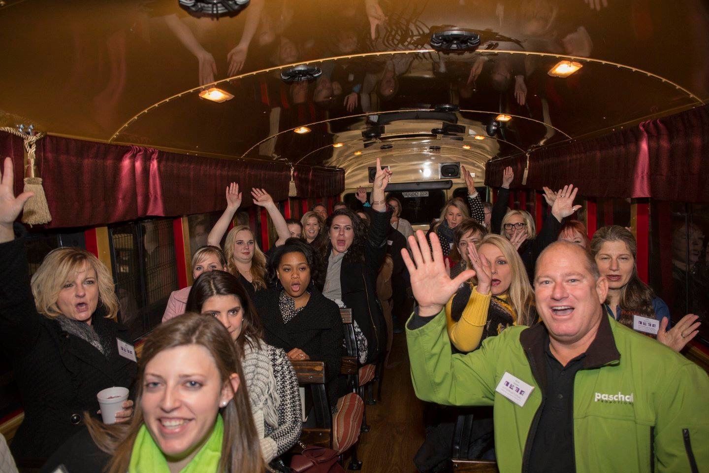 A group of coworkers laughing together at a team outing