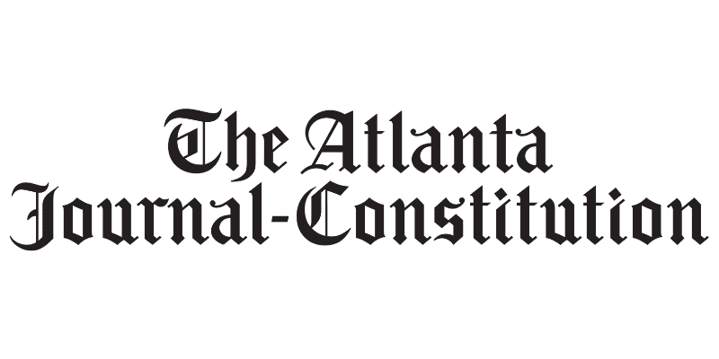 Logo of The Atlanta Journal-Constitution, newspaper title in black gothic font.