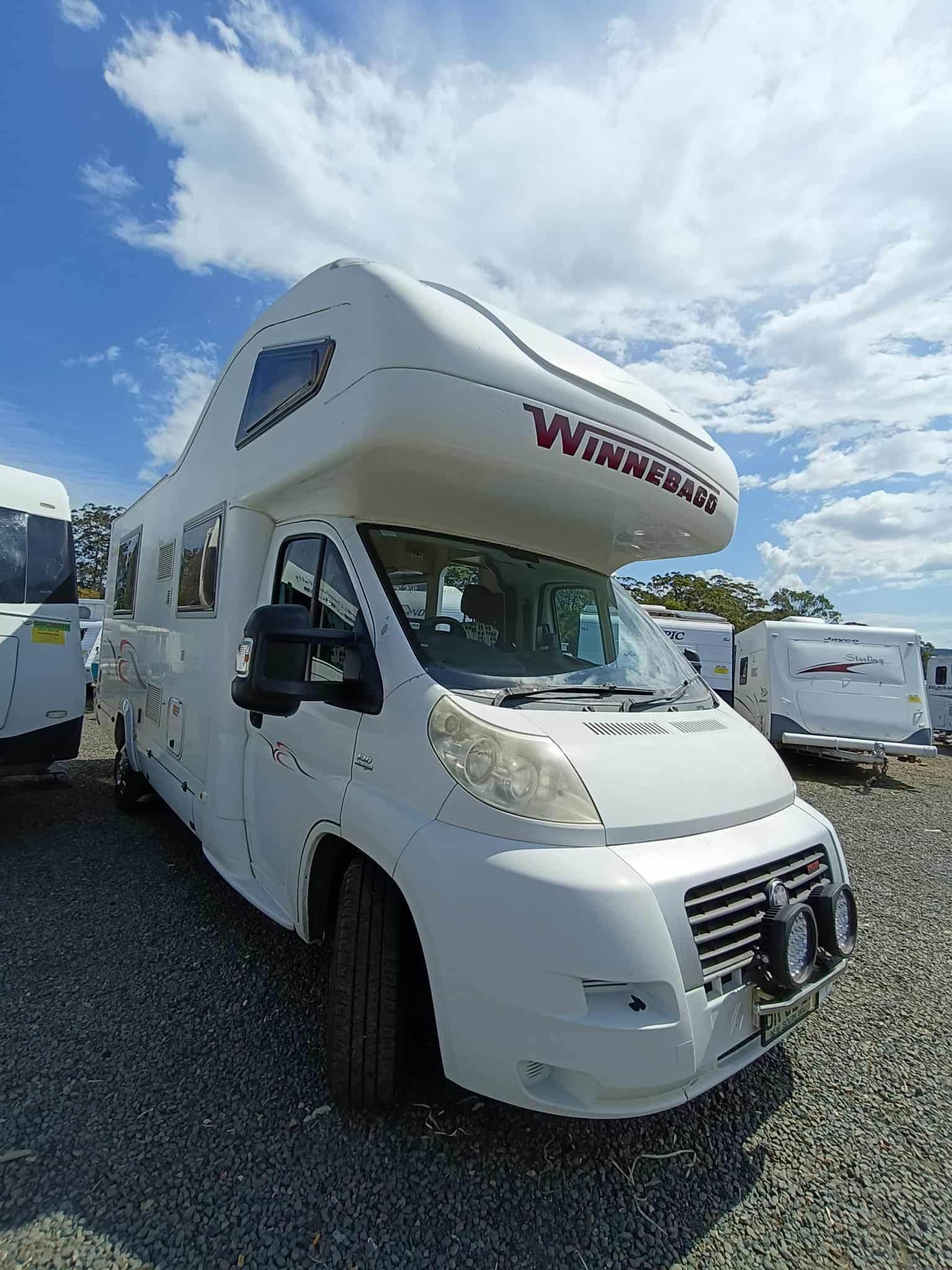 White Winnebago RV Parked in a Lot — Great Lakes Caravans & RV P/L In Nabiac, NSW