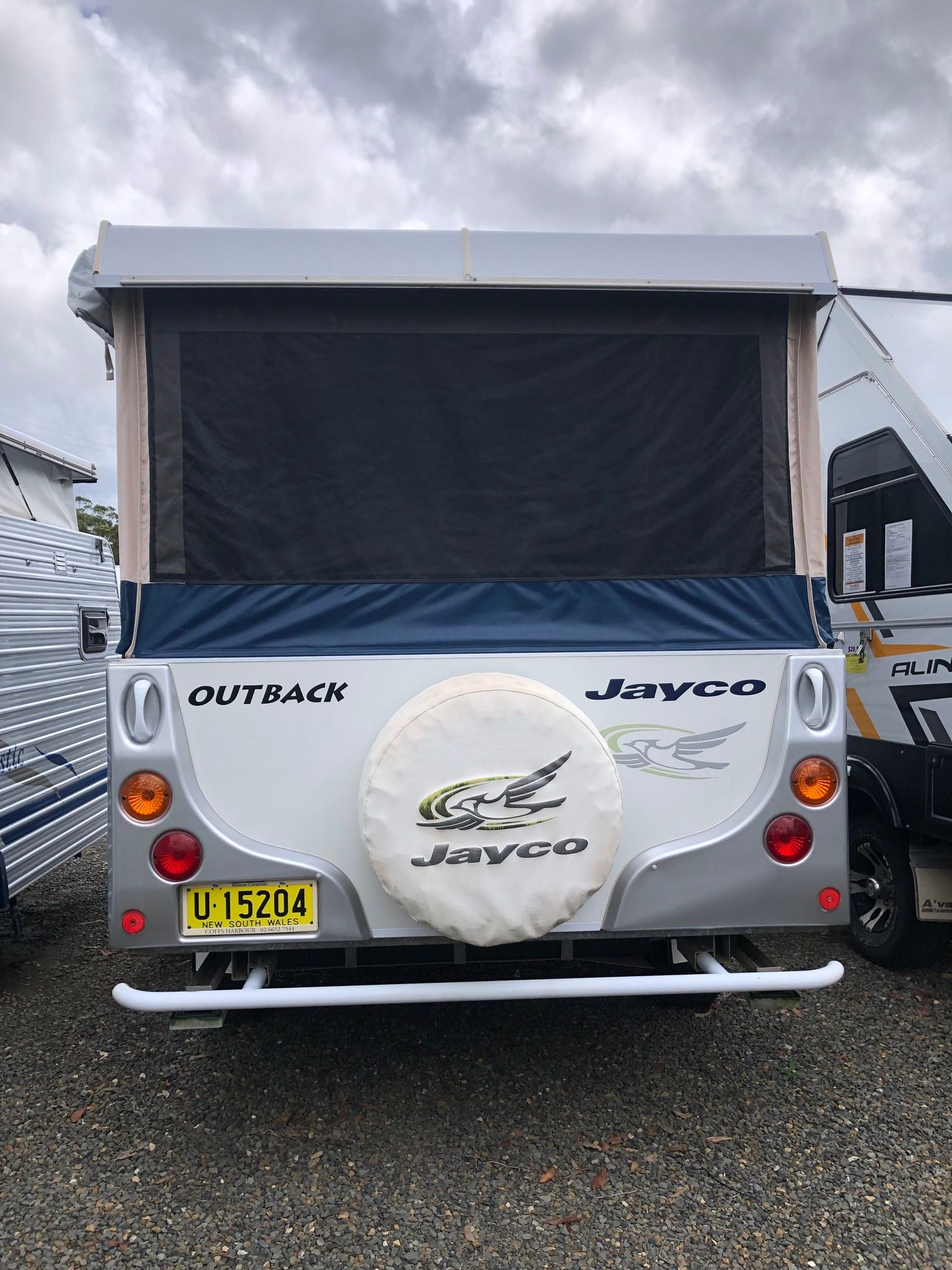 Rear View of a Silver and White Jayco Outback Camper Trailer — Great Lakes Caravans & RV P/L In Mid North Coast, NSW