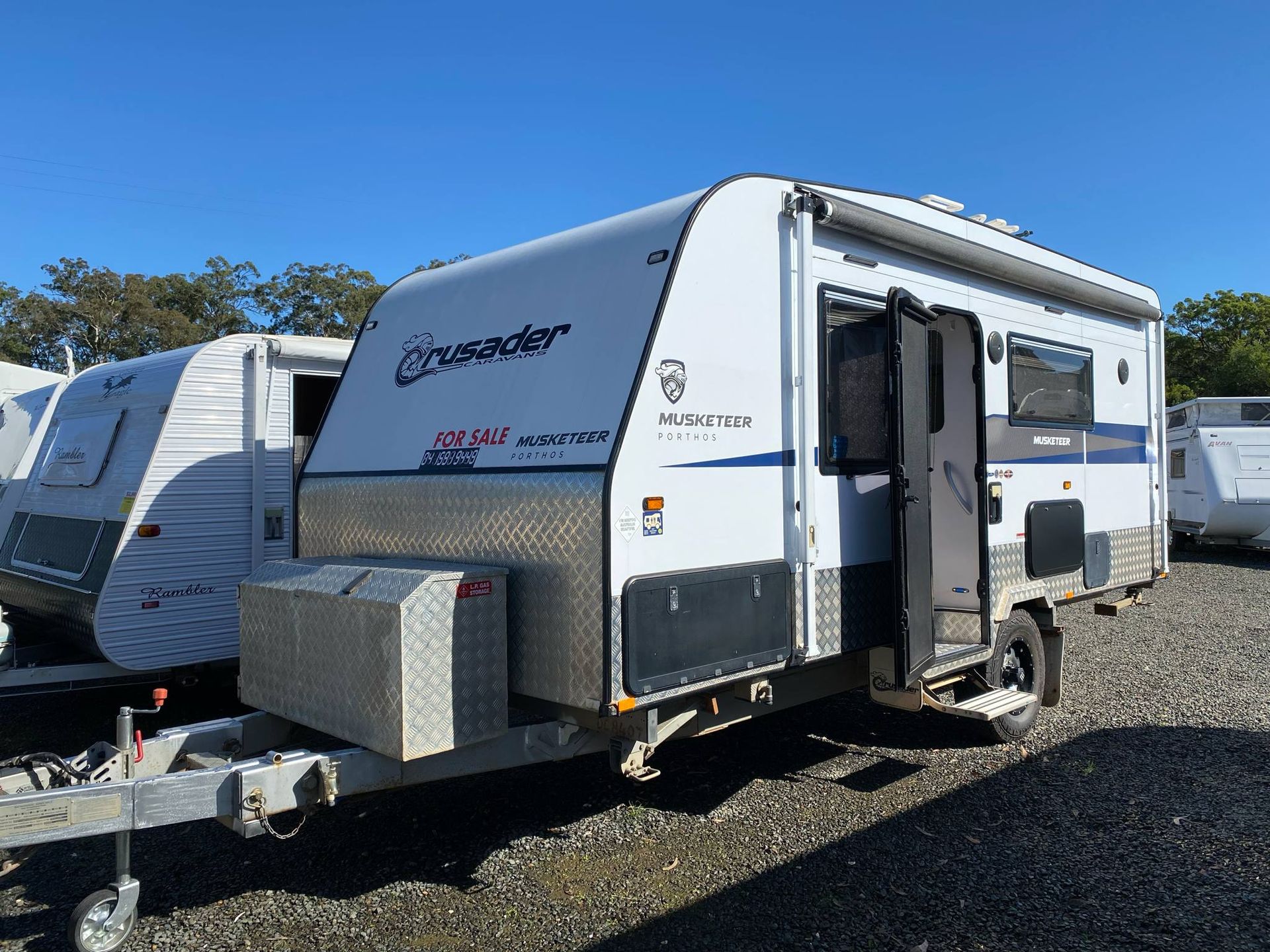 White and Blue Caravan With Open Door — Great Lakes Caravans & RV P/L In Mid North Coast, NSW