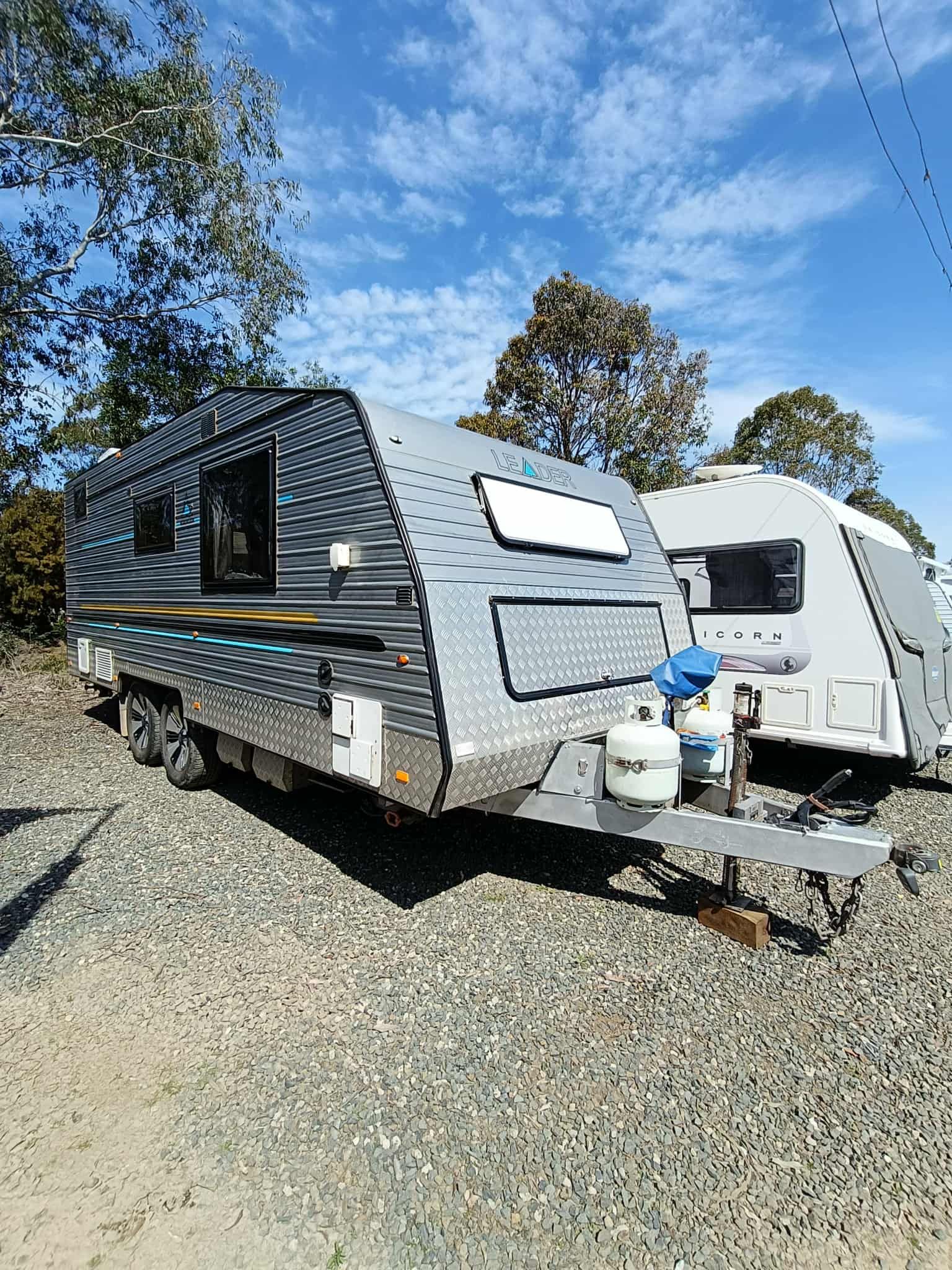 Grey and Silver Travel Trailer Parked Outdoors — Great Lakes Caravans & RV P/L In Mid North Coast, NSW