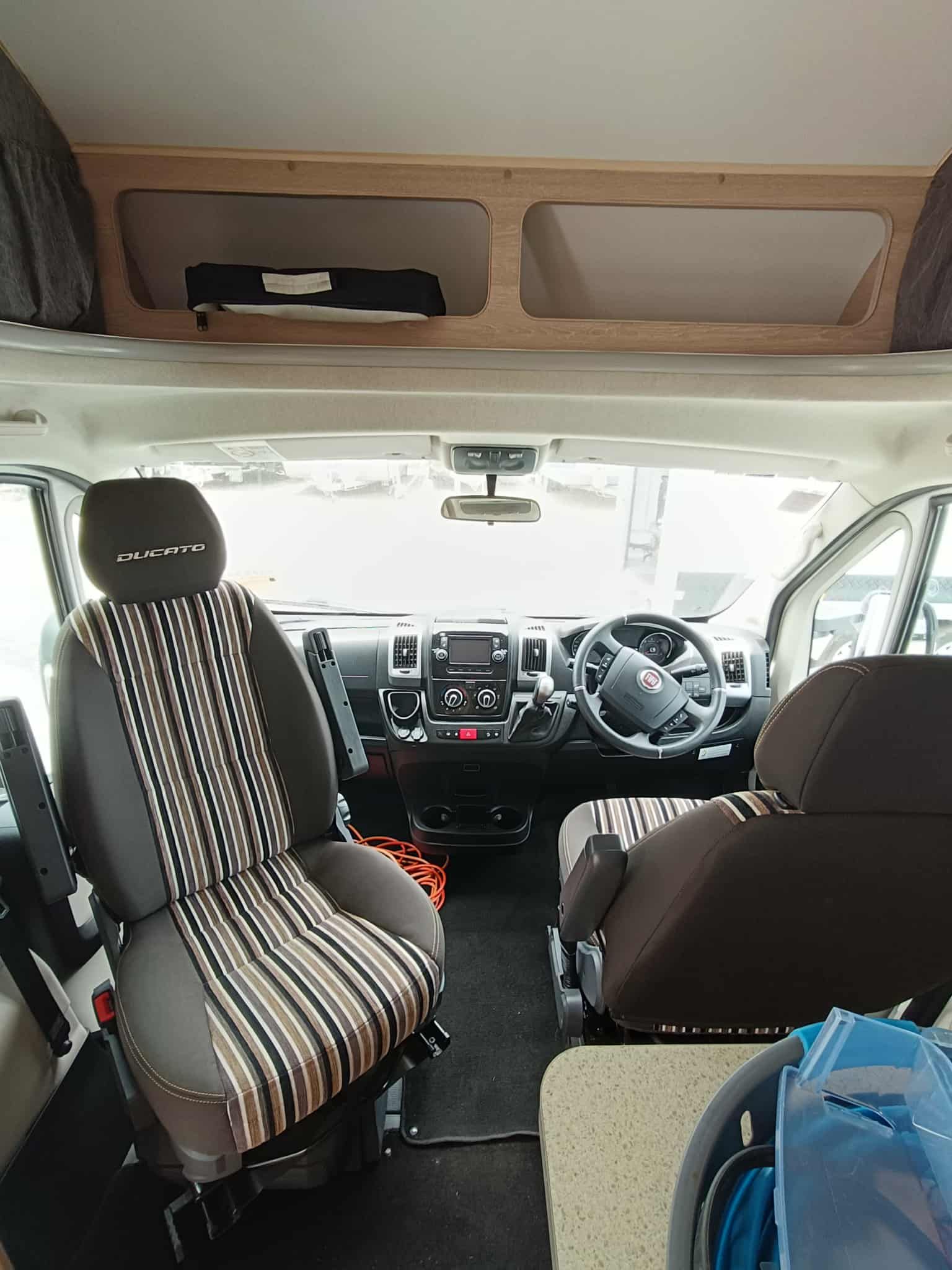 Interior of a Campervan, Showcasing the Driver's Area With Seats — Great Lakes Caravans & RV P/L In Nabiac, NSW