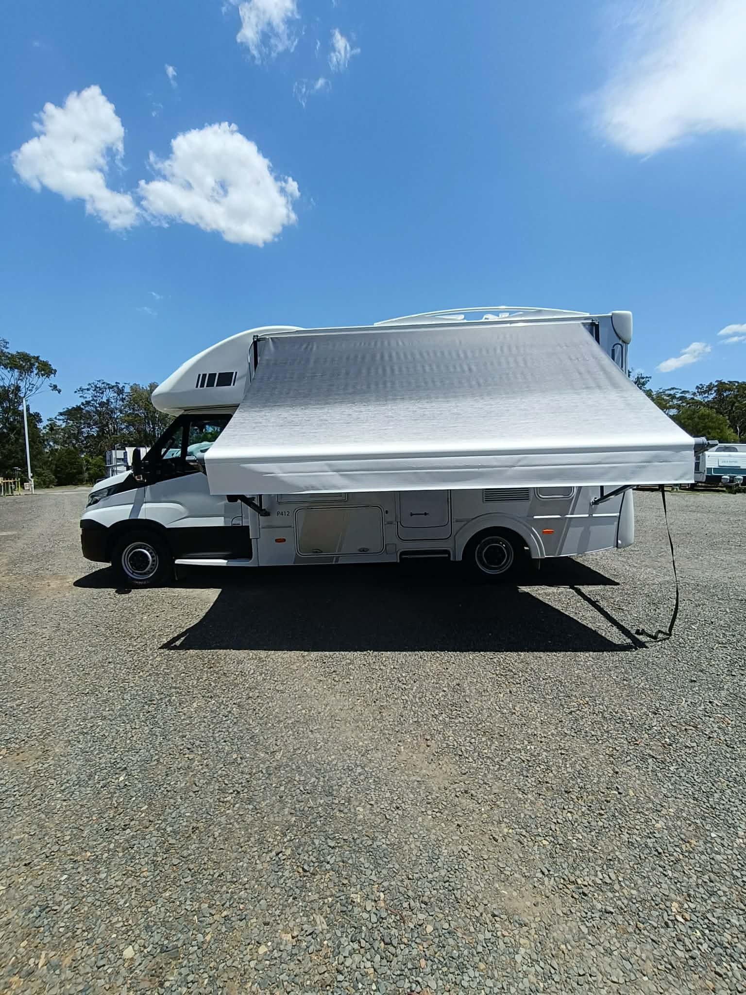 White Campervan With Awning Extended — Great Lakes Caravans & RV P/L In Mid North Coast, NSW