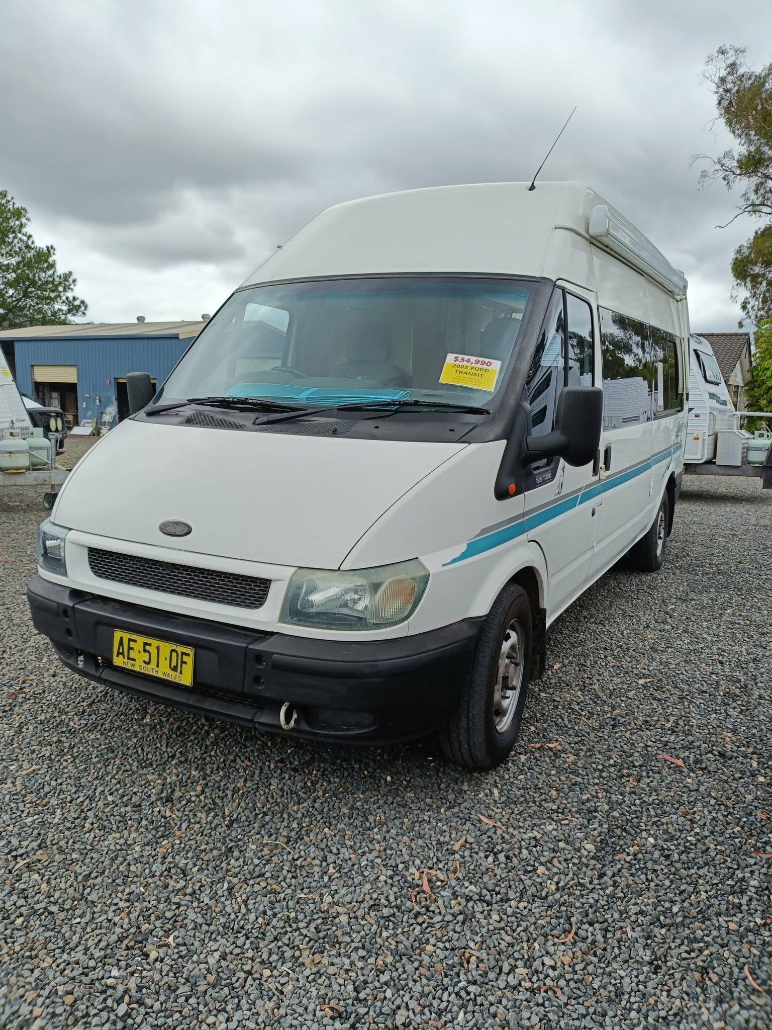 White Ford Transit Van With High Roof and Blue Accents — Great Lakes Caravans & RV P/L In Mid North Coast, NSW