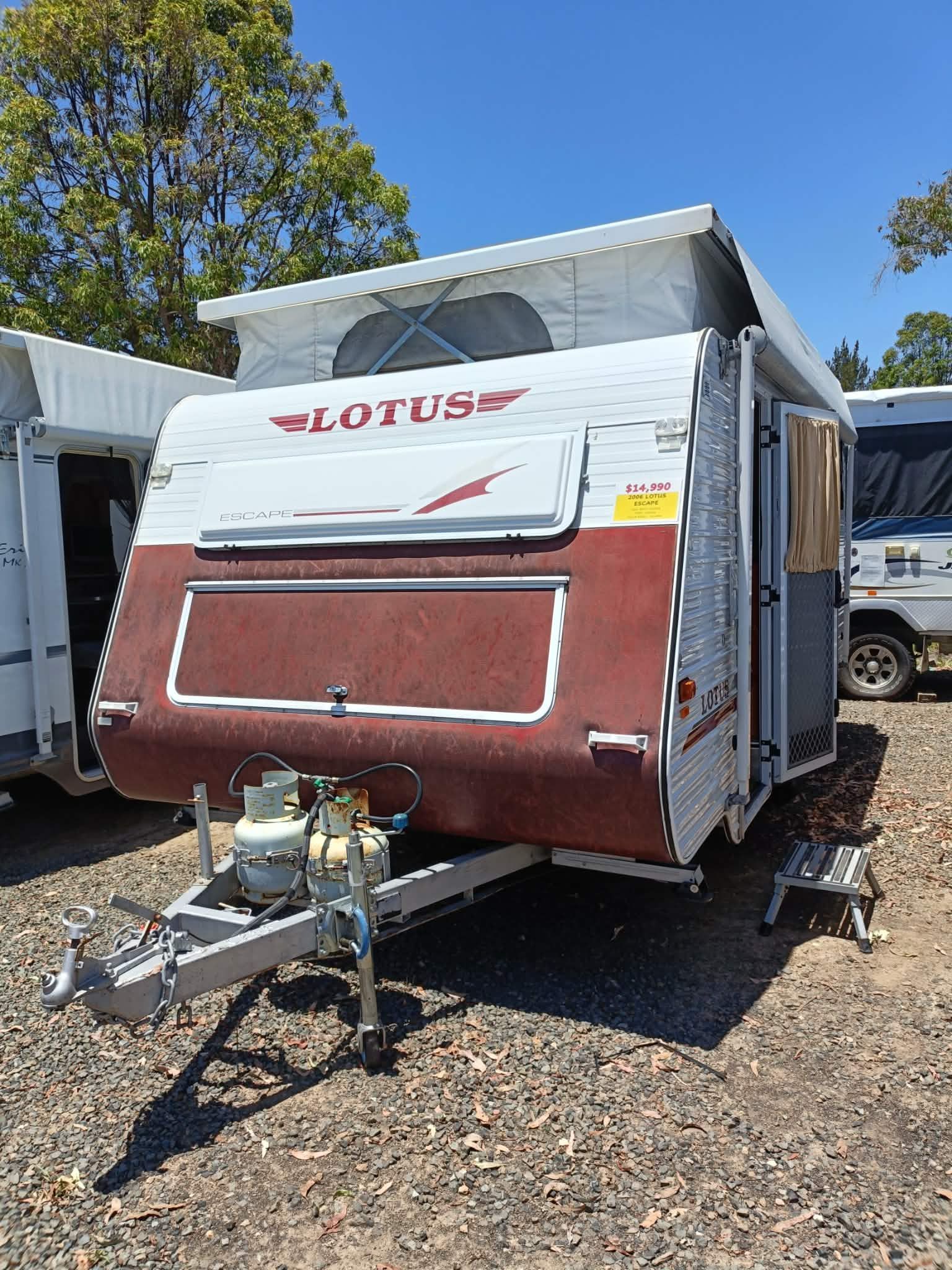 A Brown and White Lotus Caravan Parked Outdoors — Great Lakes Caravans & RV P/L In Nabiac, NSW