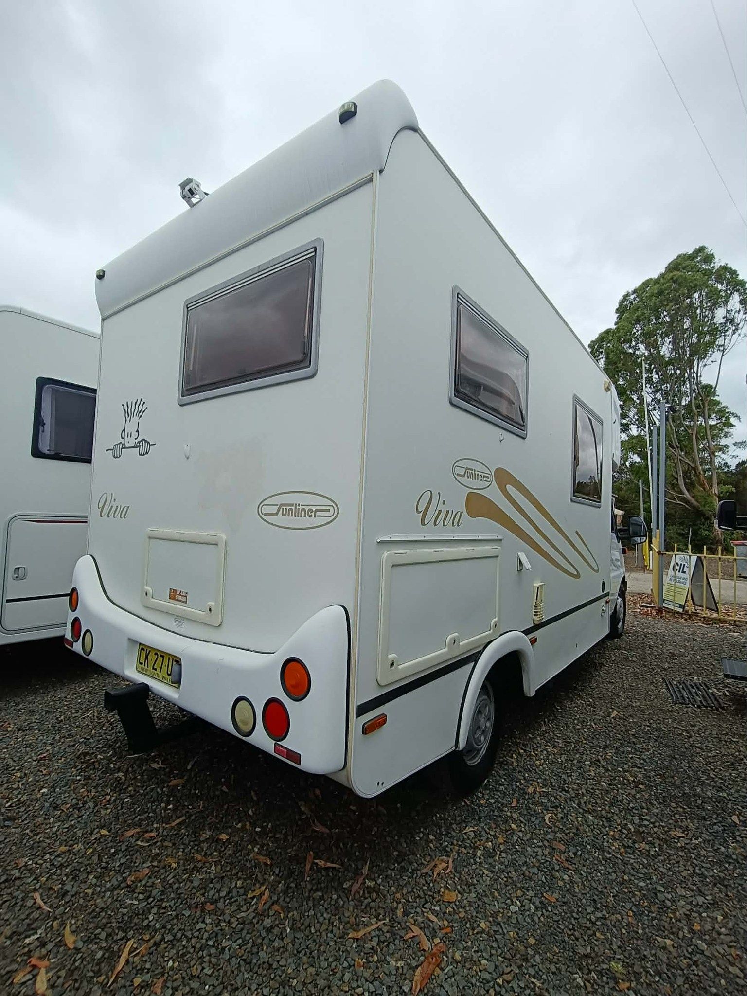White Campervan With Windows and Decals — Great Lakes Caravans & RV P/L In Maitland, NSW