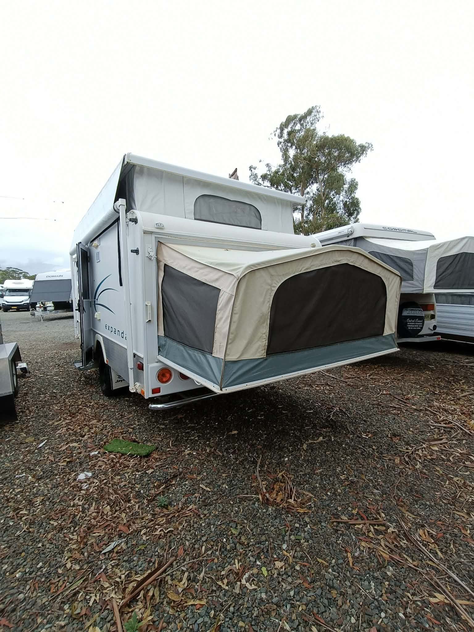 White camper trailer with pop-up tent - Great Lakes Caravans & RV P/L In Port Macquarie, NSW