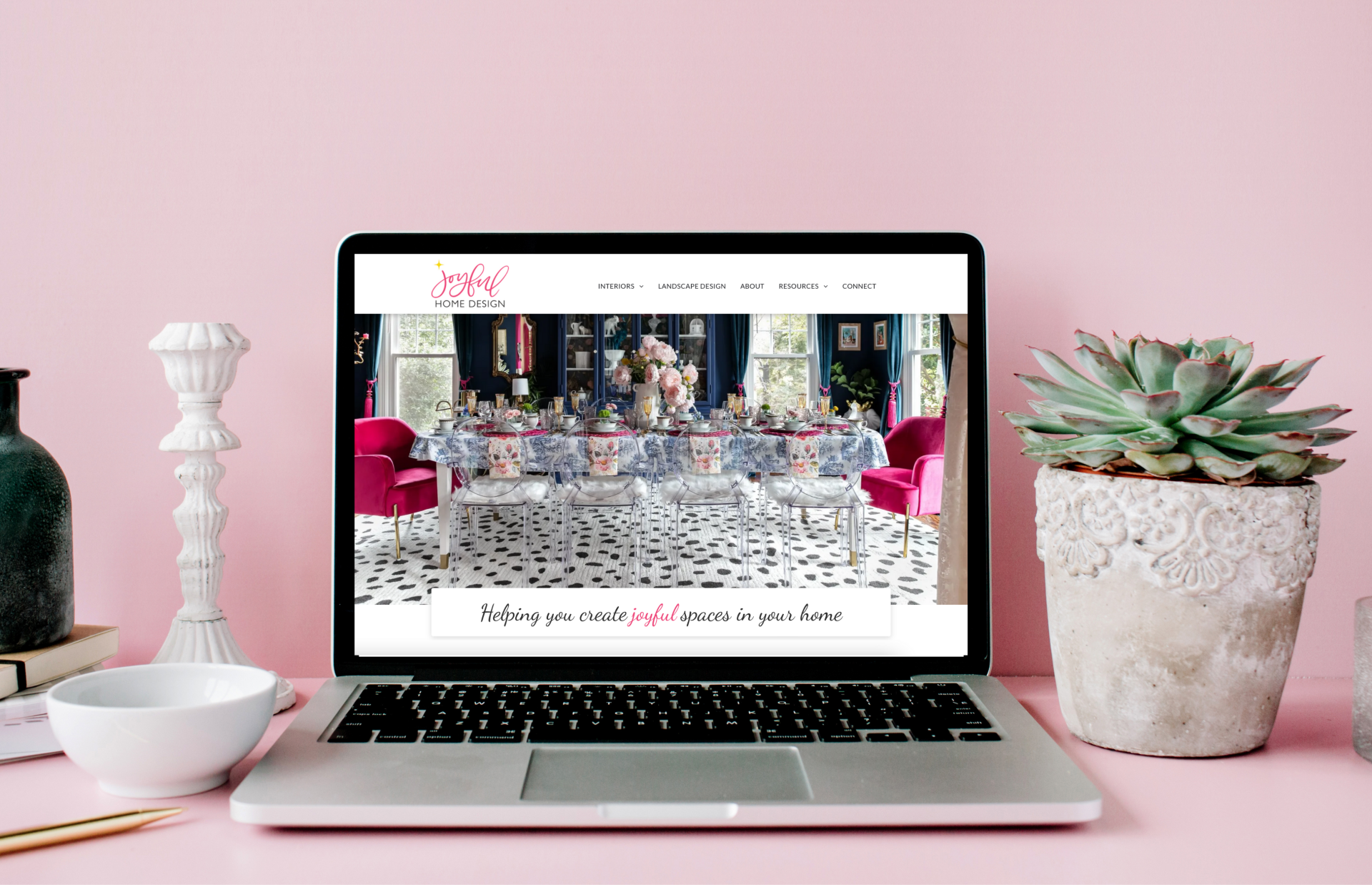 Pink background with laptop computer