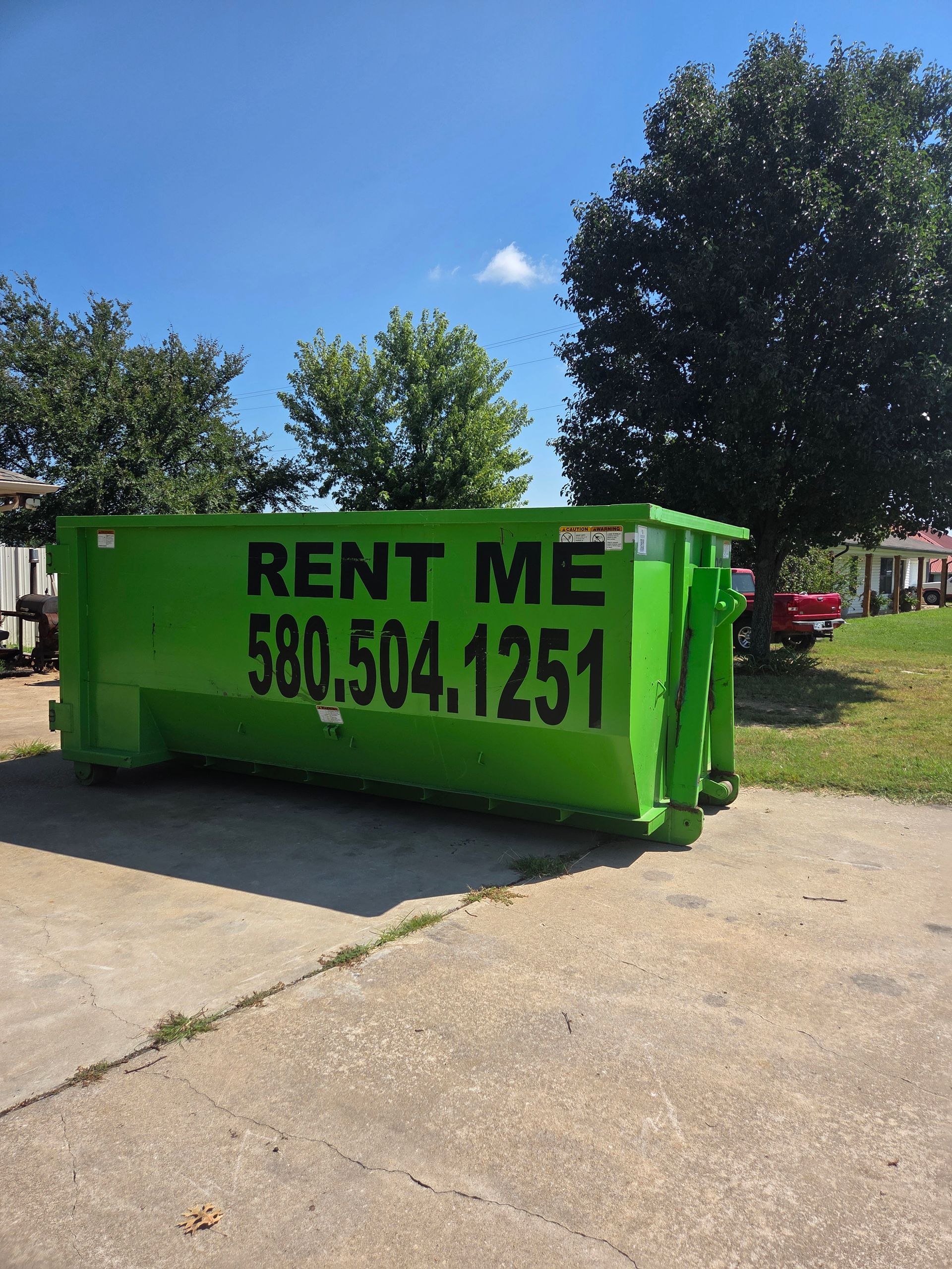Green dumpster with 
