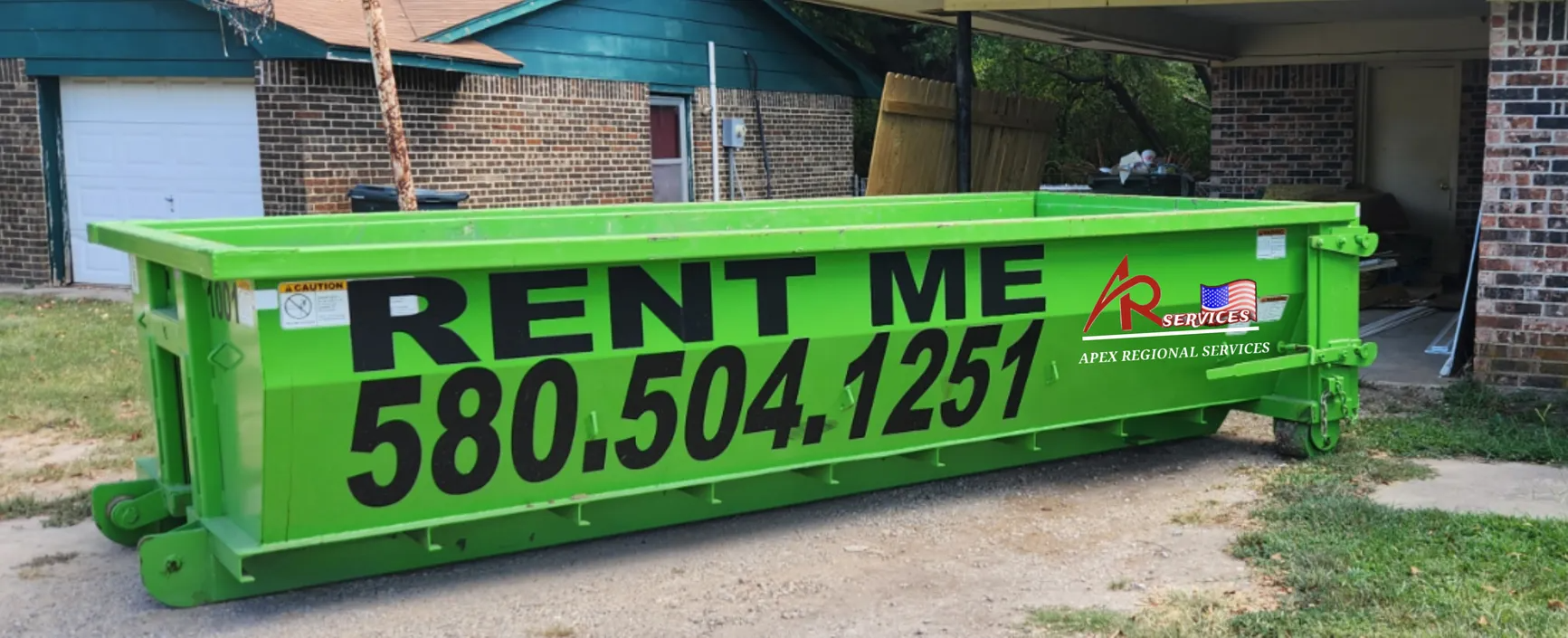 A bright green dumpster with 