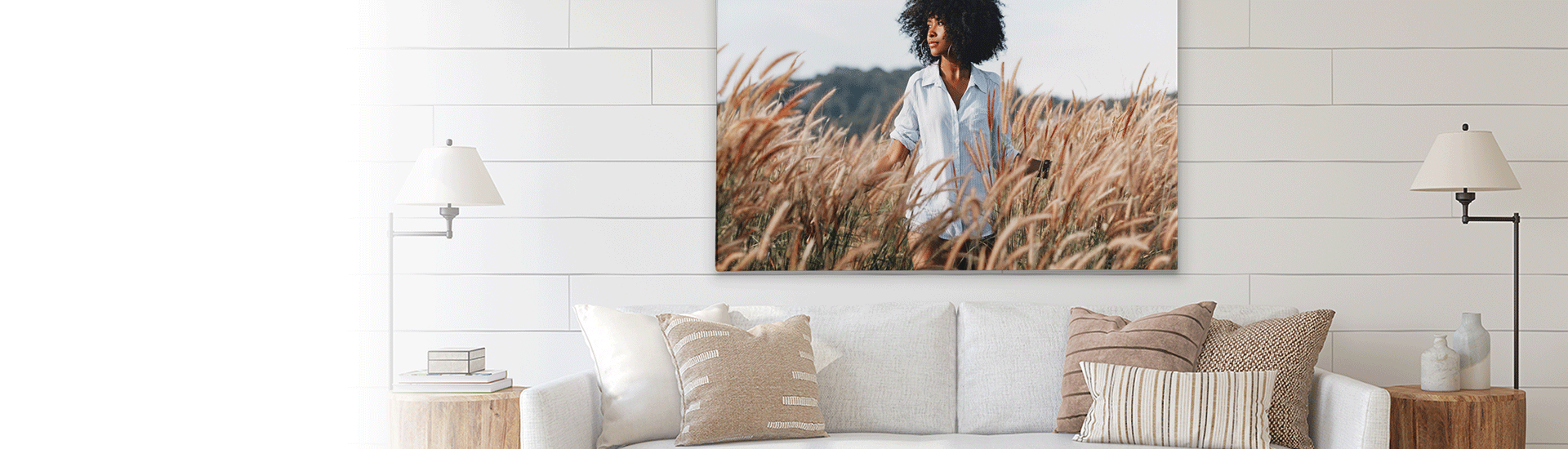 a living room with a couch and a large painting on the wall .