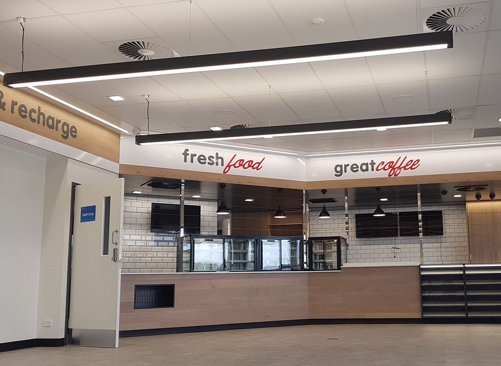 A Restaurant with a Counter and a Sign — Cairns Excel Electrics In Bungalow, QLD