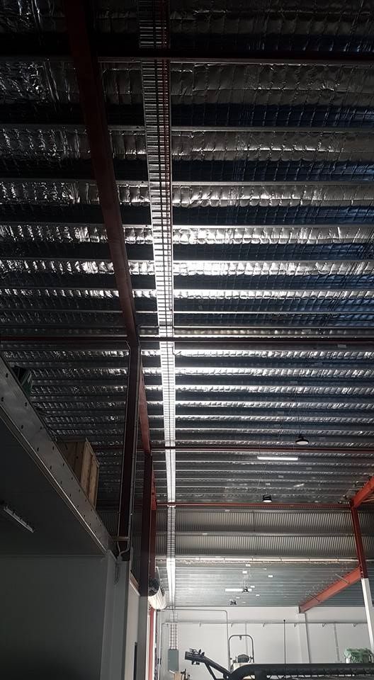 The Ceiling Of A Building With A Lot Of Metal Beams — Cairns Excel Electrics In Bungalow, QLD