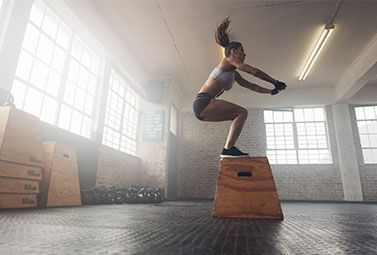Female exercising high jump