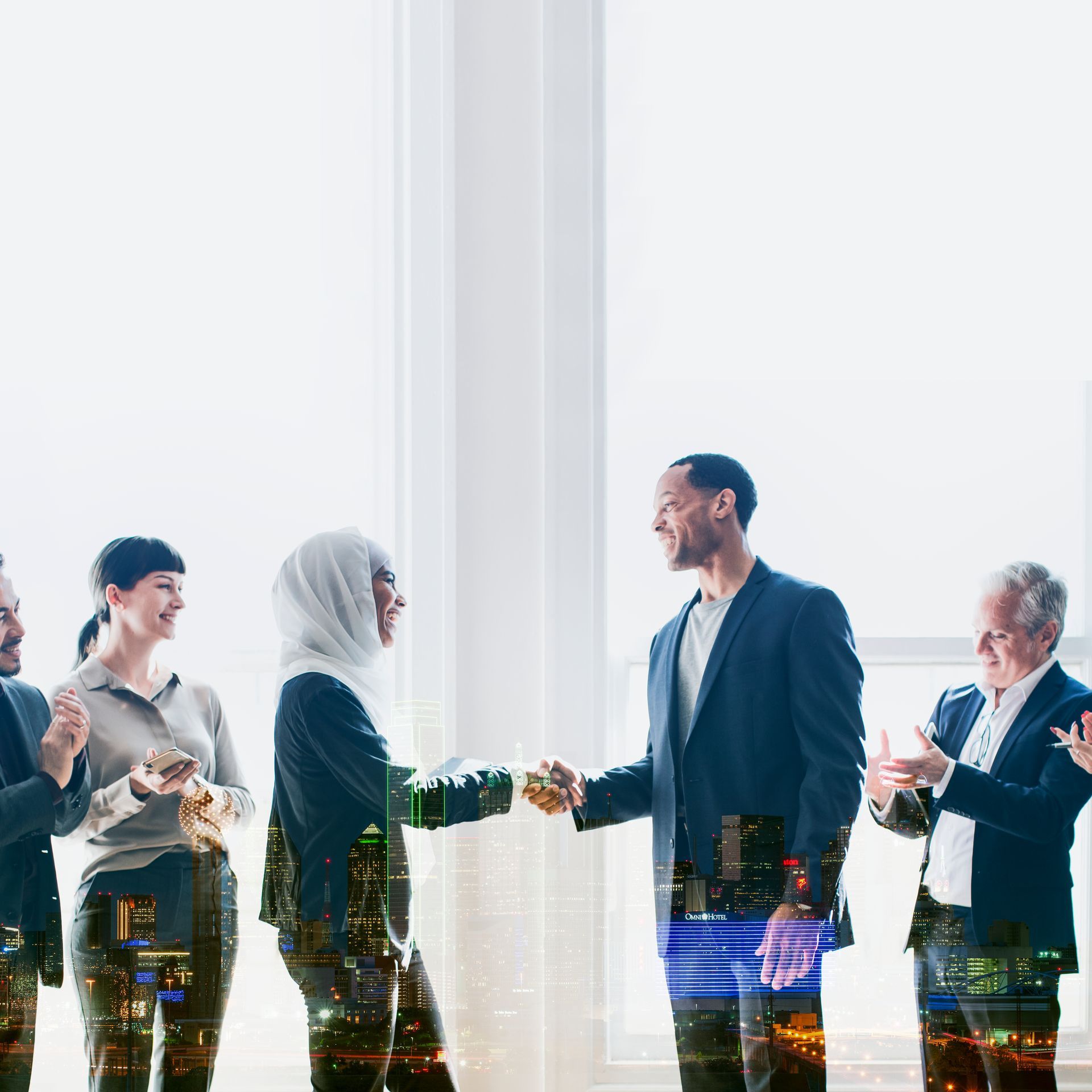 A diverse group of professionals in business attire shake hands in a bright, modern office with a city skyline overlay.