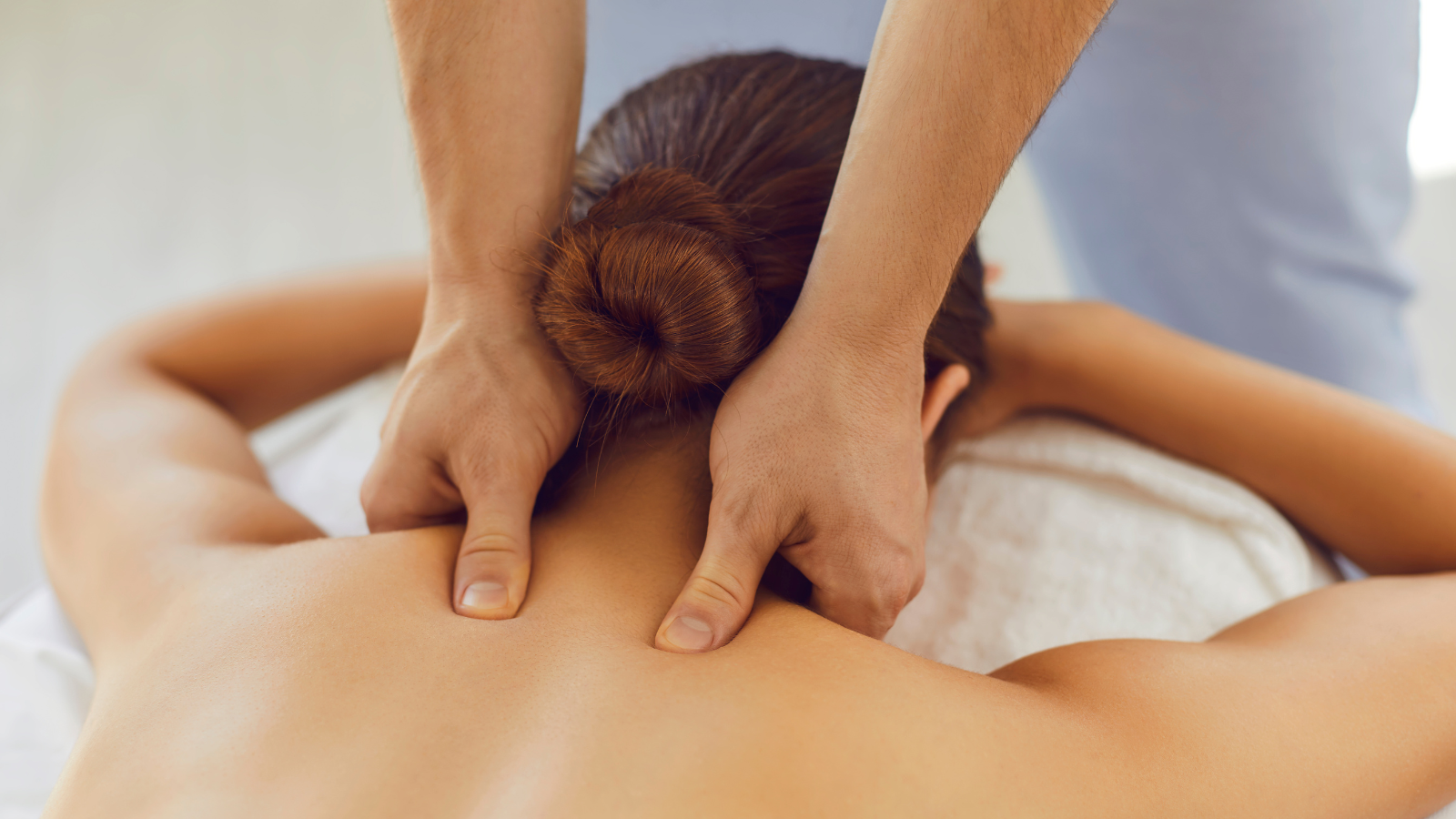A woman is getting a massage at a spa.