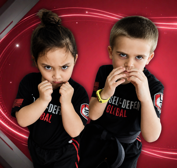 Two kids in black T-shirts pose with boxing stances against a red swirling background.