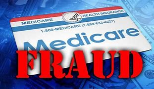 A medicare card is sitting on top of a pile of money.