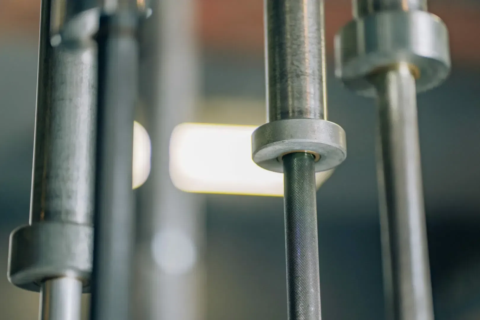 A close up of a bunch of metal bars in a gym.
