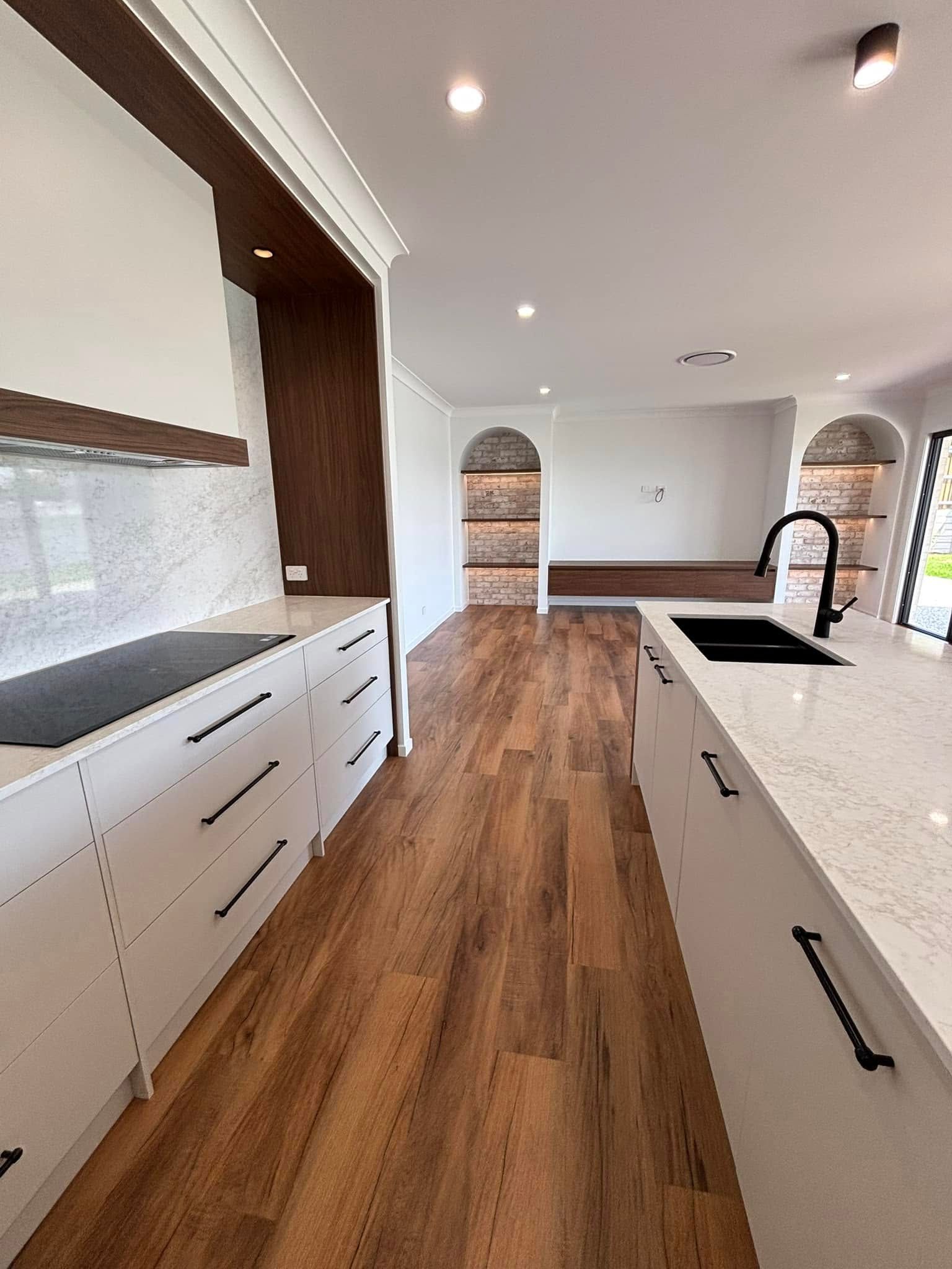 A Bathroom With Two Sinks and a Large Mirror — Windamere Homes in Highfields, QLD