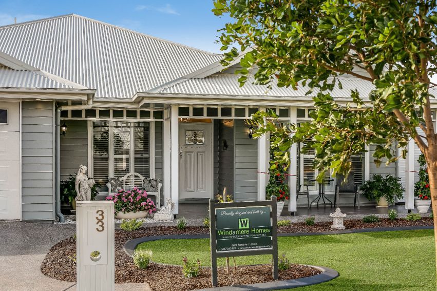 A House With a for Sale Sign in Front of It — Windamere Homes in Highfields, QLD