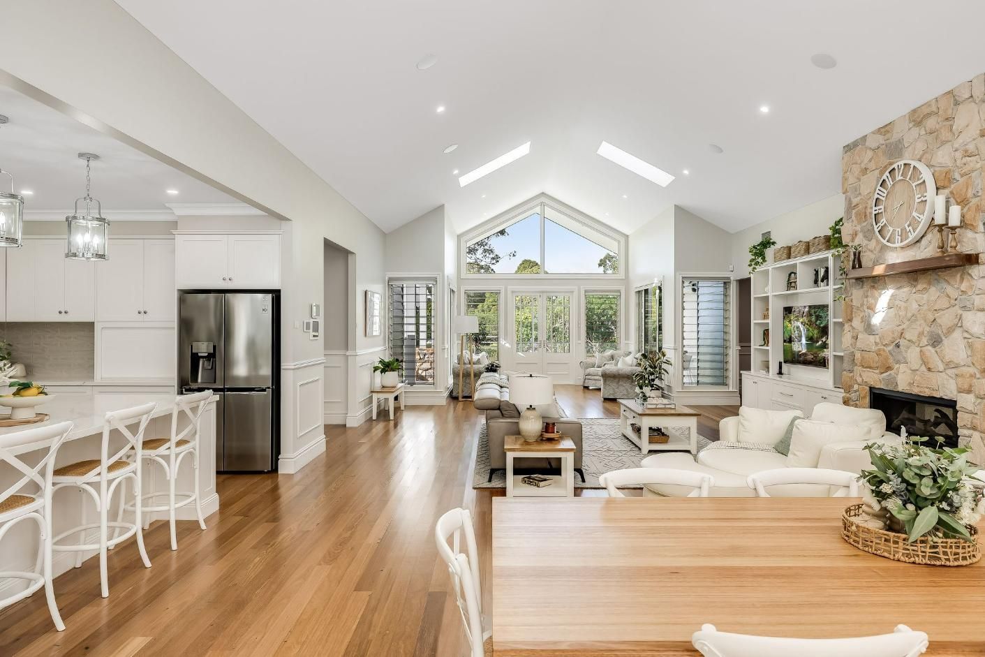A Living Room Floors, Table, and Kitchen — Windamere Homes in Highfields, QLD