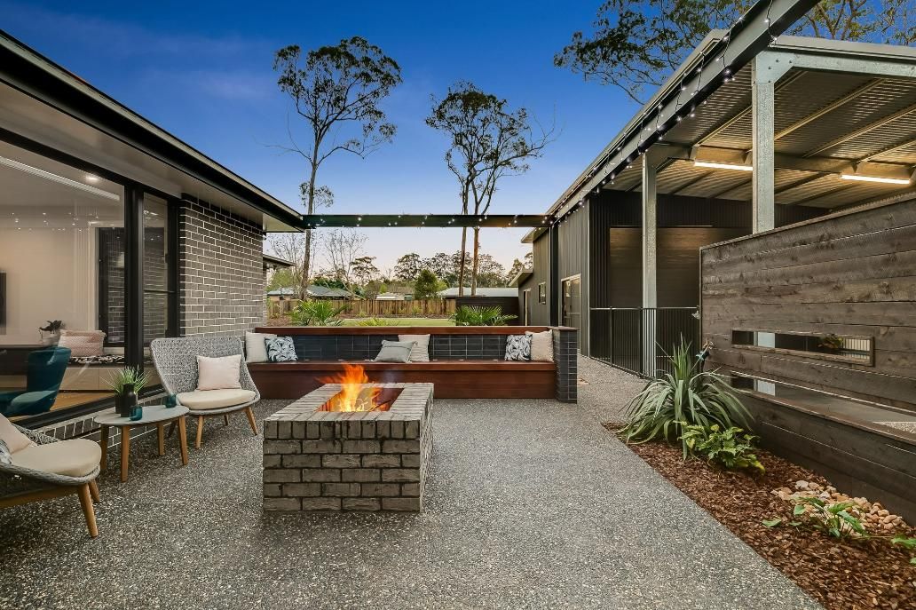 There is a Fire Pit in the Middle of the Courtyard — Windamere Homes in Highfields, QLD