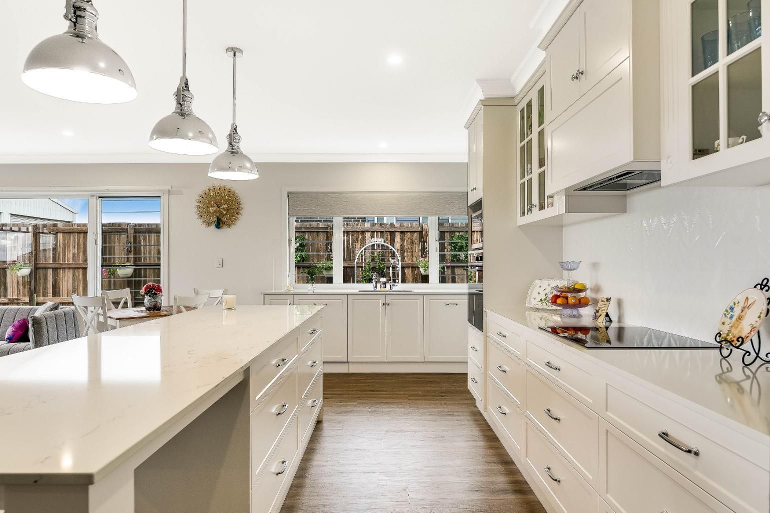 A Kitchen With White Cabinets — Windamere Homes in Highfields, QLD
