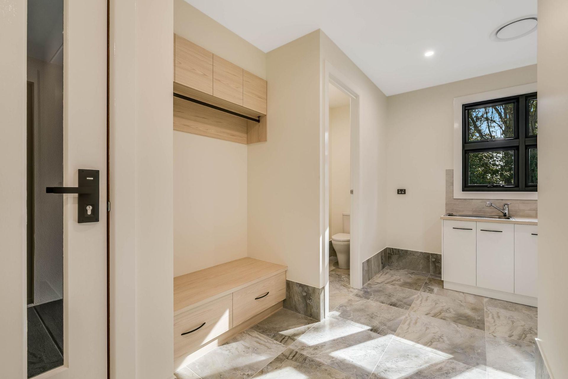 A Laundry Room With a Sink — Windamere Homes in Highfields, QLD