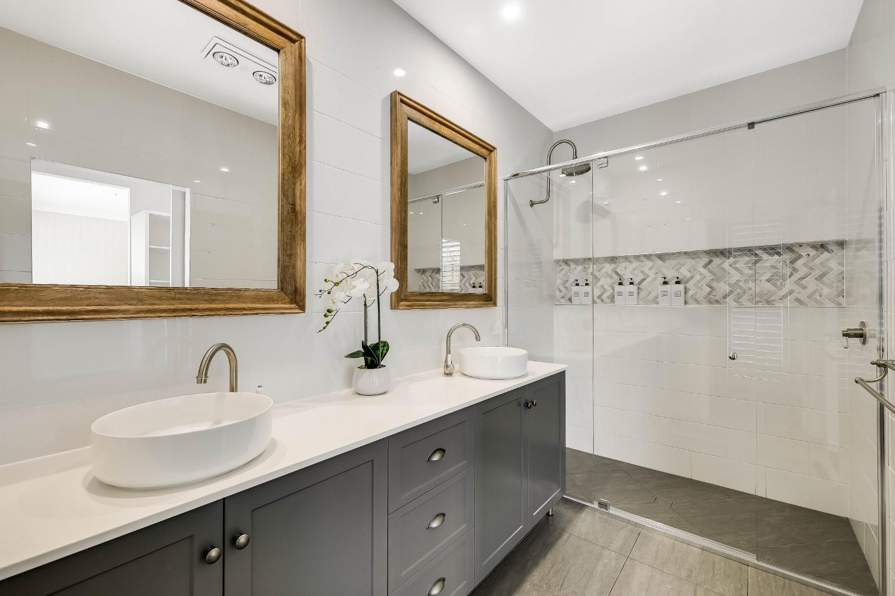 A Bathroom With Two Sink — Windamere Homes in Highfields, QLD