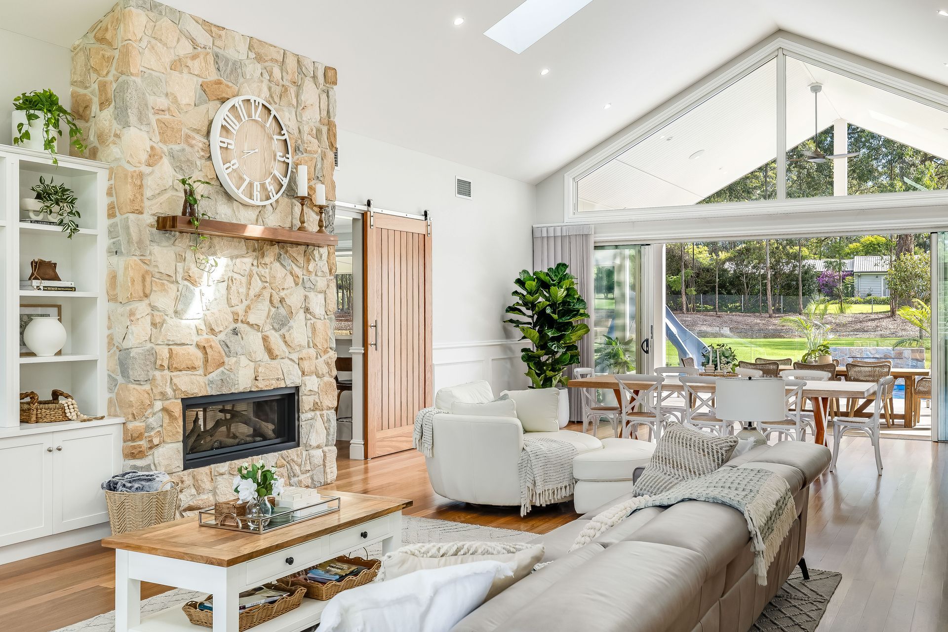 A living room filled with furniture and a fireplace. — Windamere Homes in Highfields, QLD