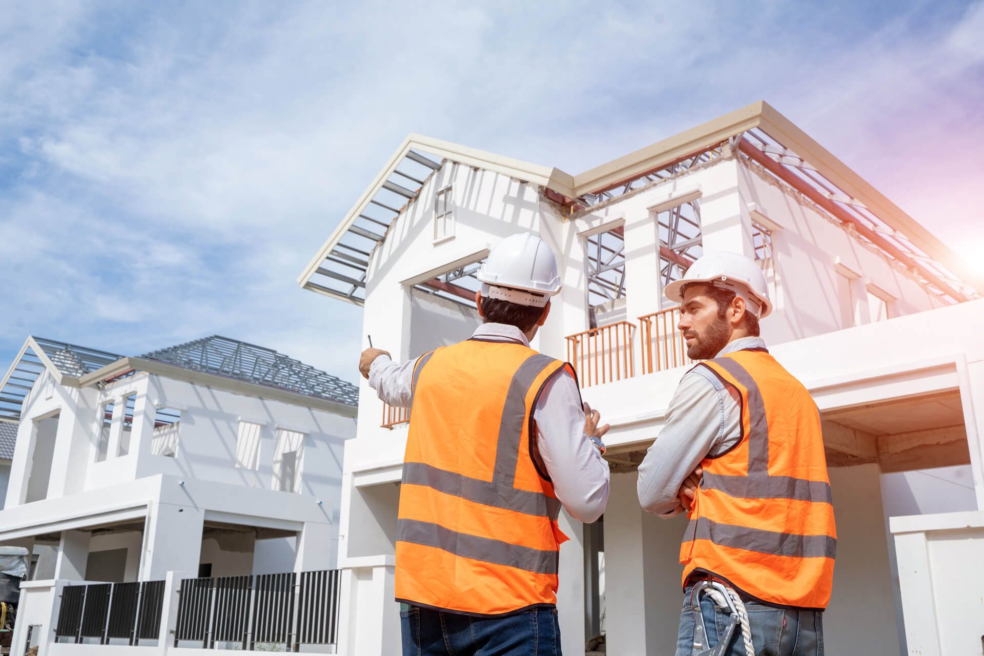 Engineers discussing house construction