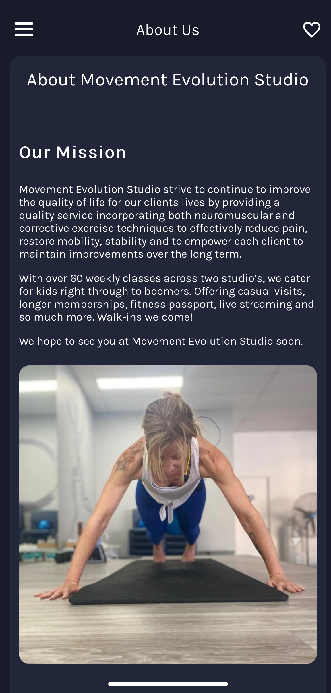 A woman is doing push ups on a yoga mat on a phone screen. movement evolution studio mobile app screen shot